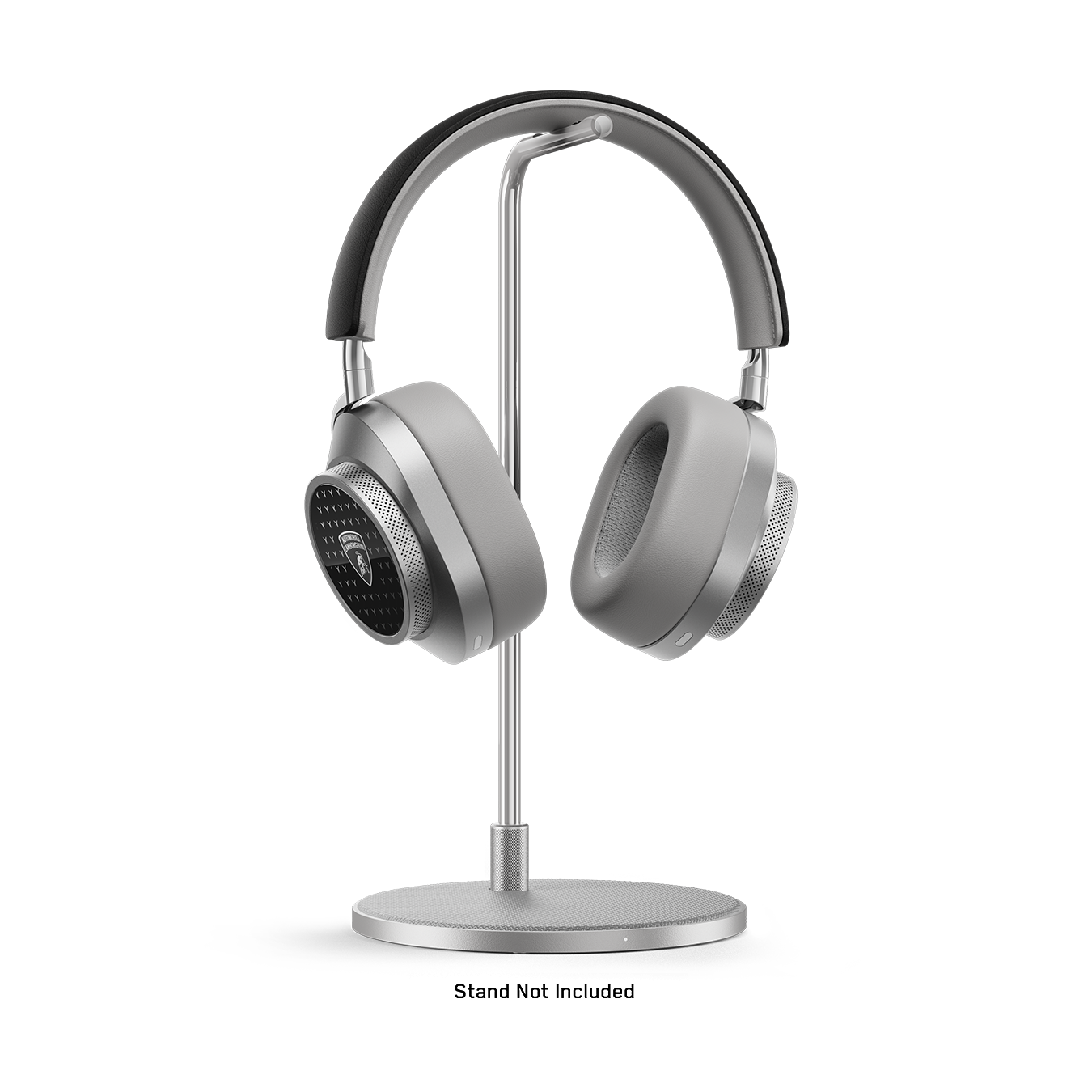 Silver, black and white Automobili Lamborghini MW75 Active Noise-Cancelling Headphones placed on a silver headphone stand