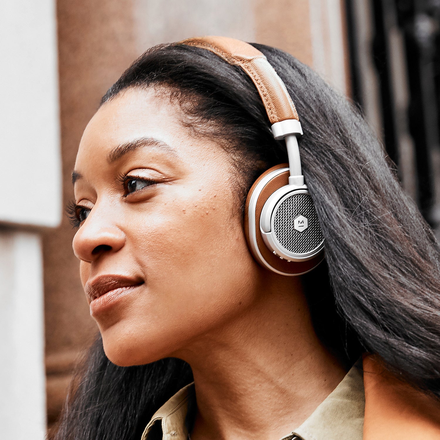 Lifestyle image of the MW50+ 2-in-1 Wireless Headphones with on-ear earpads on a female model | gallery MW50S2+