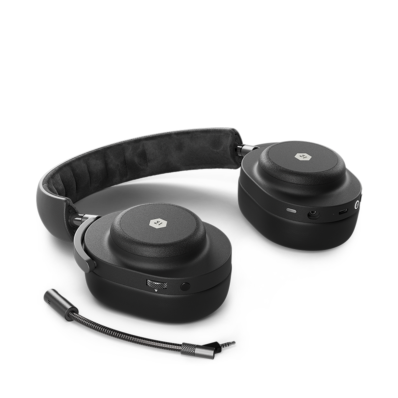Onyx black MG20 Wireless Gaming Headphones laying on a flat surface next to a detachable boom microphone | gallery MG20B1