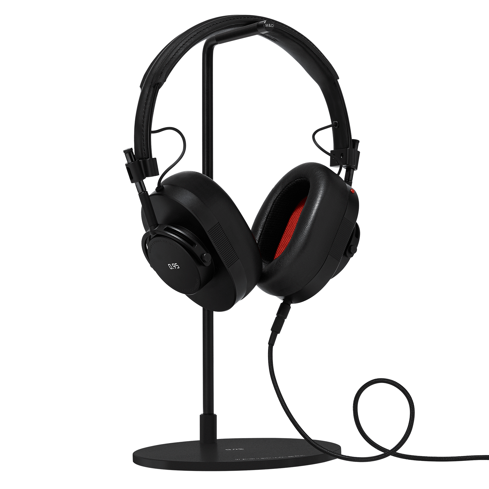 Black leather and metal MH40 Wireless headphones with Leica 0.95 logo on the ear cup placed on a black headphone stand with optional 3.5mm audio cable | gallery MH40B-95