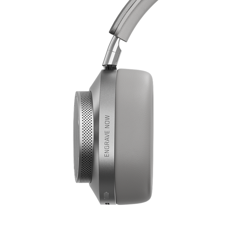 Close-up of silver TUMI MW75 Active Noise-Cancelling Headphones showing ear cup and optional engraving | gallery MW75S-TUMI