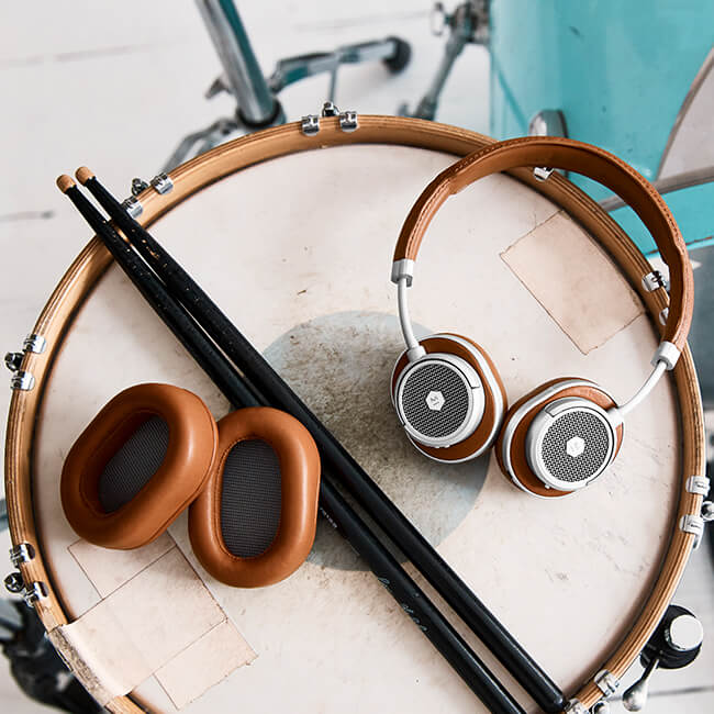 Lifestyle image of MW50+ Headphones and MW50+ Over-Ear Ear Pads