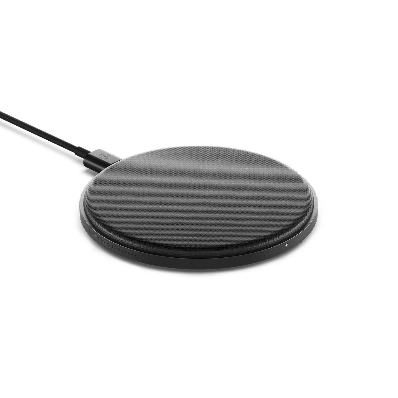 Gunmetal MC100 Wireless Charge Pad plugged into a black charging cable | gallery MC100G1