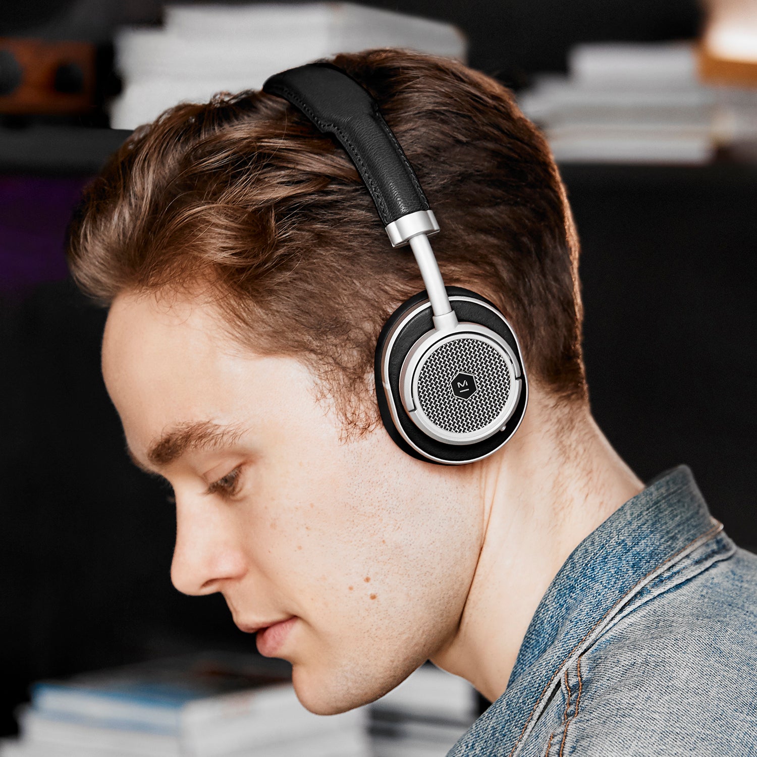 Lifestyle image of the MW50+ 2-in-1 Wireless headphones with over-wear earpads on a male model | gallery MW50S1+