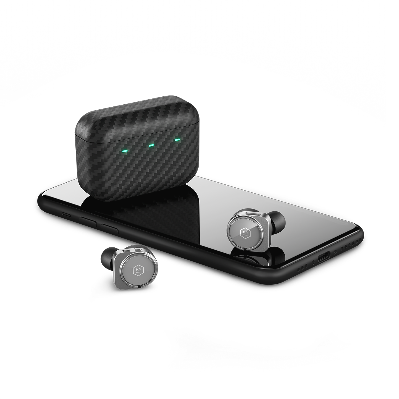Pair of gunmetal MW09 True Wireless Earphones and Kevlar charging case next to a black cell phone for scale | gallery MW09G3